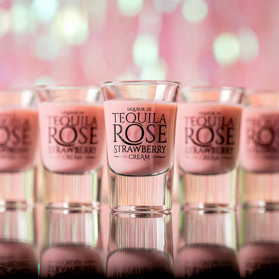Tequila Rose Strawberry Cream shots with a blurred pink background