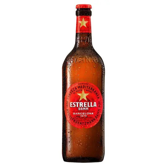 Estrella Damm beer bottle with red label on a white background