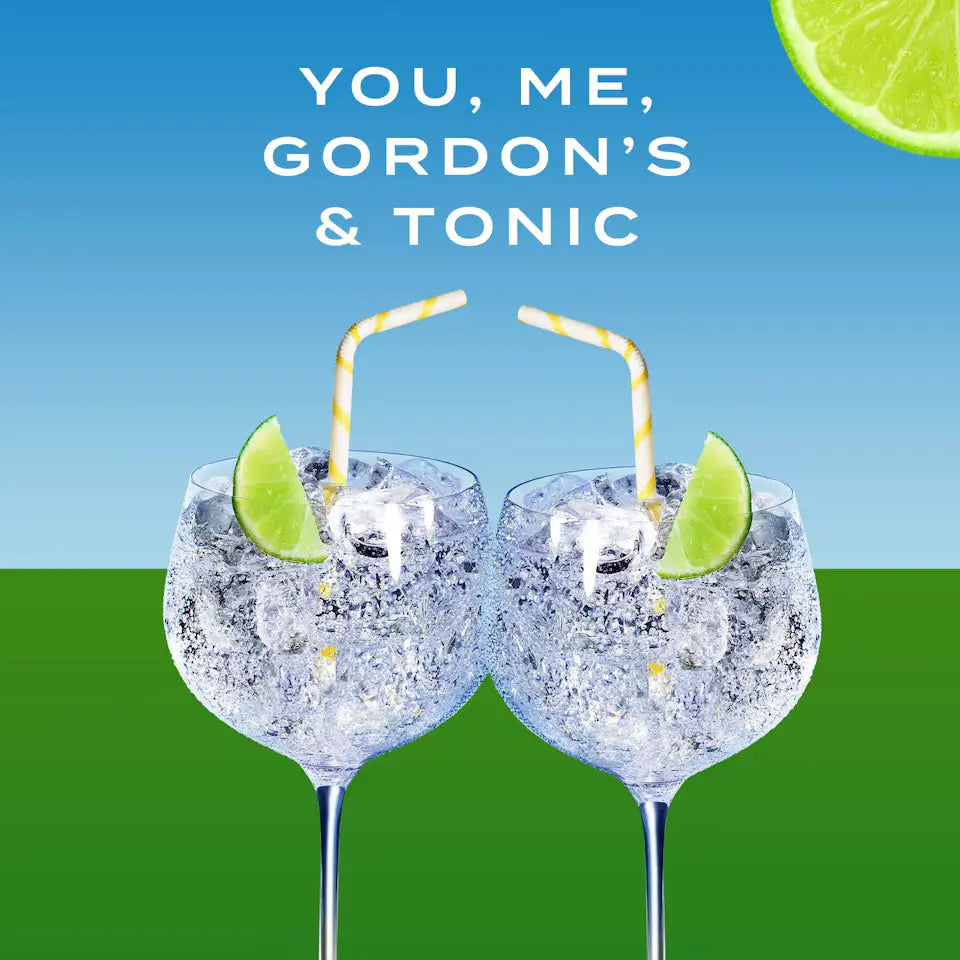 Two glasses of Gordon's gin with lime wedges and straws on a blue and green gradient background.