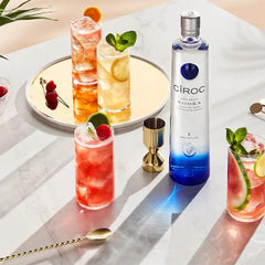 Ciroc vodka bottle with cocktails on a marble surface