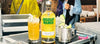Absolut Mango bottle with cocktails on a bar counter