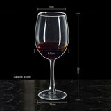 Wine glass with red wine, measurements, and capacity details on a black background