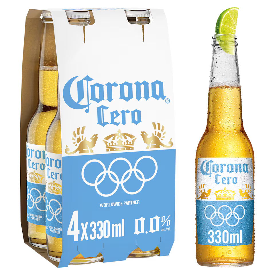 Pack of Corona Cero beer bottles with a lime wedge on a white background