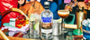 Absolut Vodka bottle with cocktails and bar accessories on a table